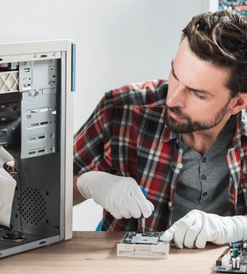 male-technician-working-broken-computer 1